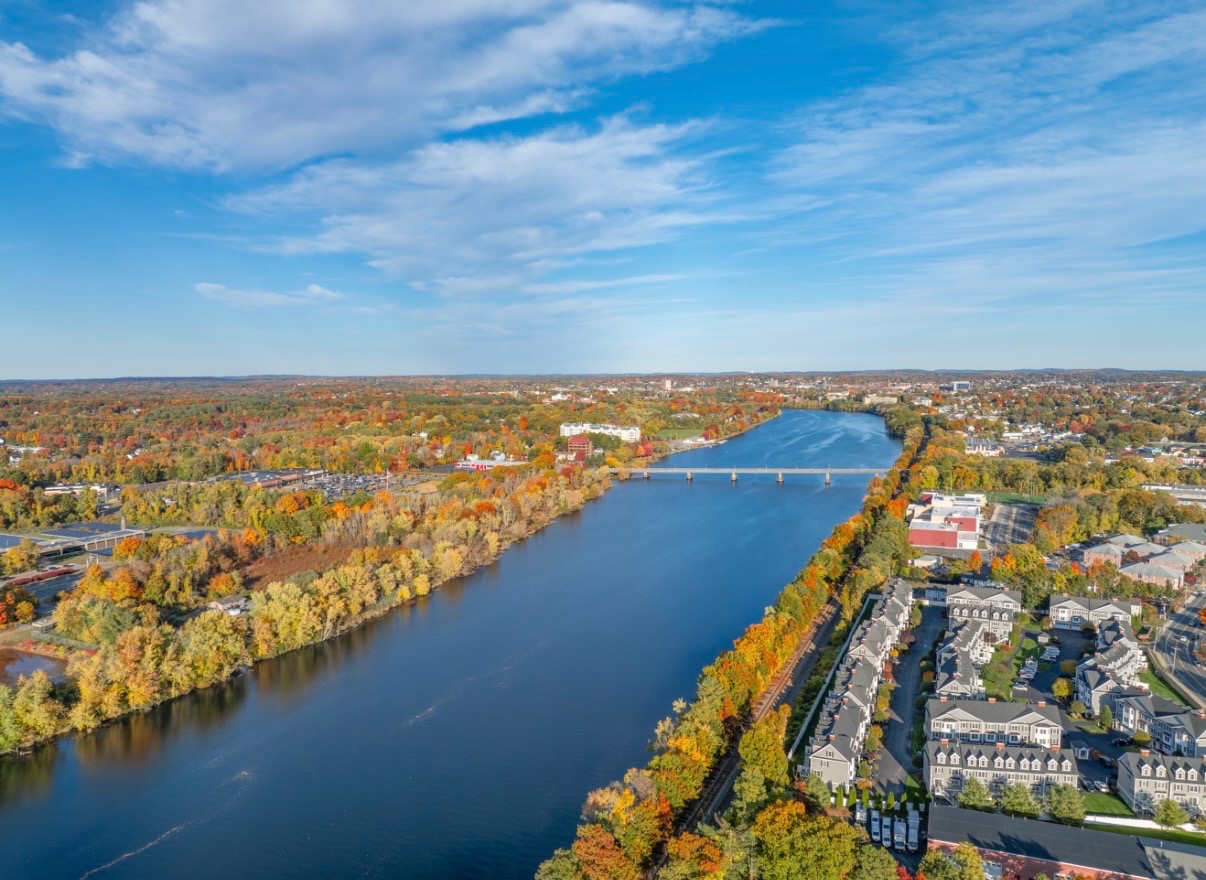 Aerial panorama of a river valley with fall foliage
